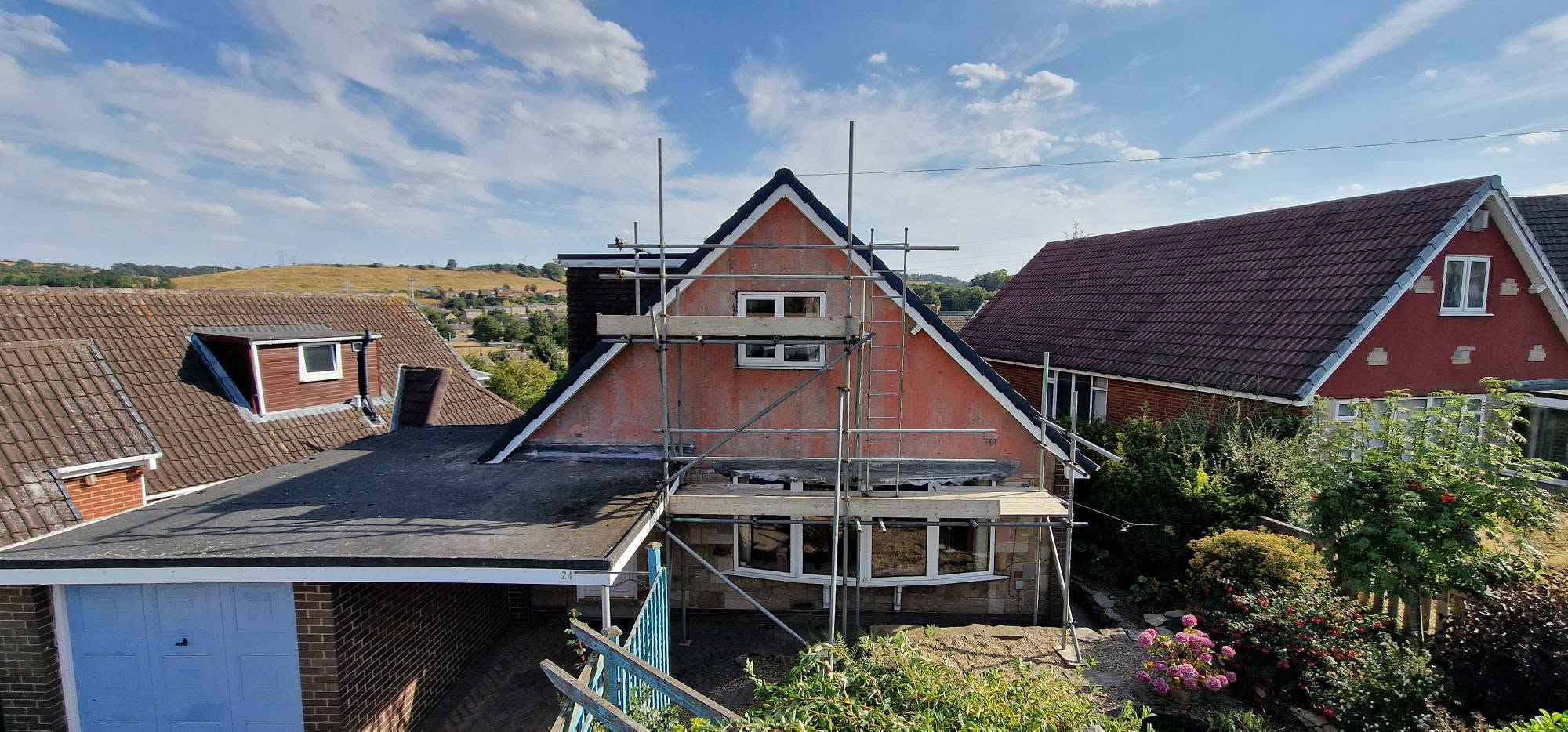 Complex pitched roof with dormers and valleys during a roof replacement